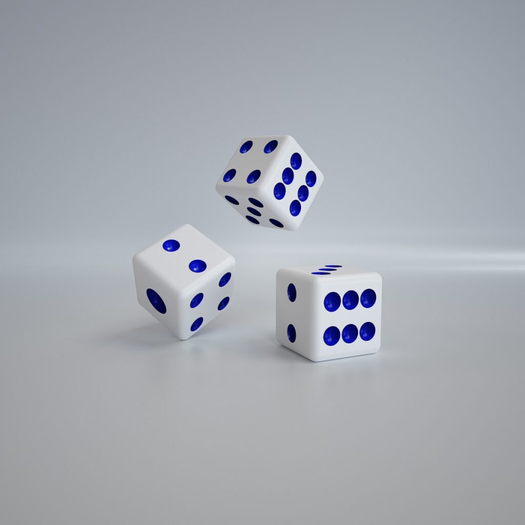 three white dices with blue dots on them